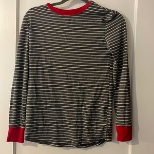 Grey striped pajama shirt with red collar and wrists